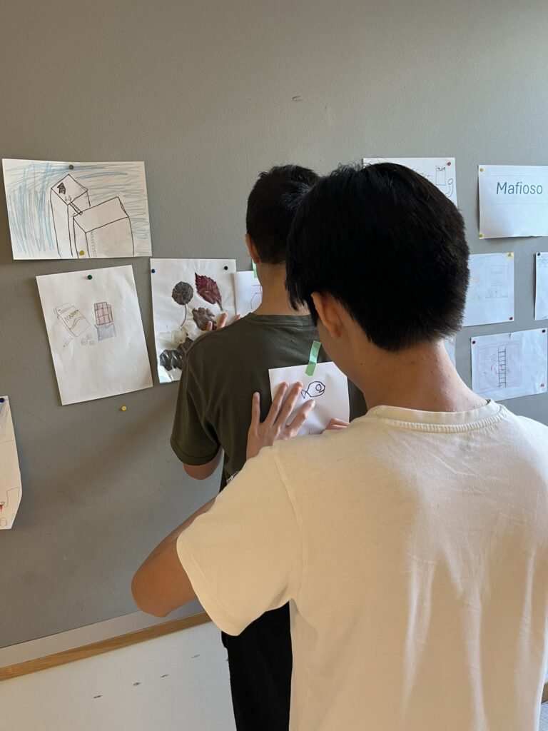 Learner writing on another learner’s superhero cape. Photo: Marte Maurabakken/Climate Creativity.