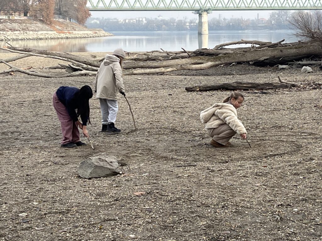 Learners collaborating to design and build their own piece of land art. Photo by Carmelo Zamora, REAL School Budapest