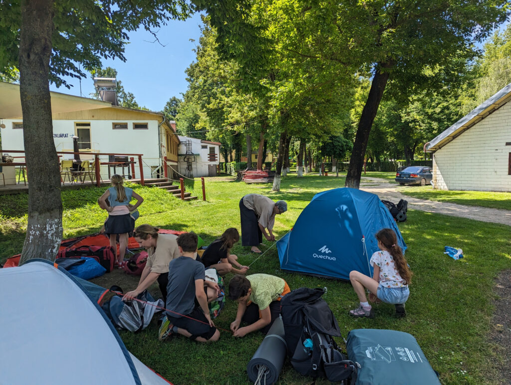 Learners setting up their tents to spend a night camping under the stars. Photo by Carmelo Zamora, REAL School Budapest