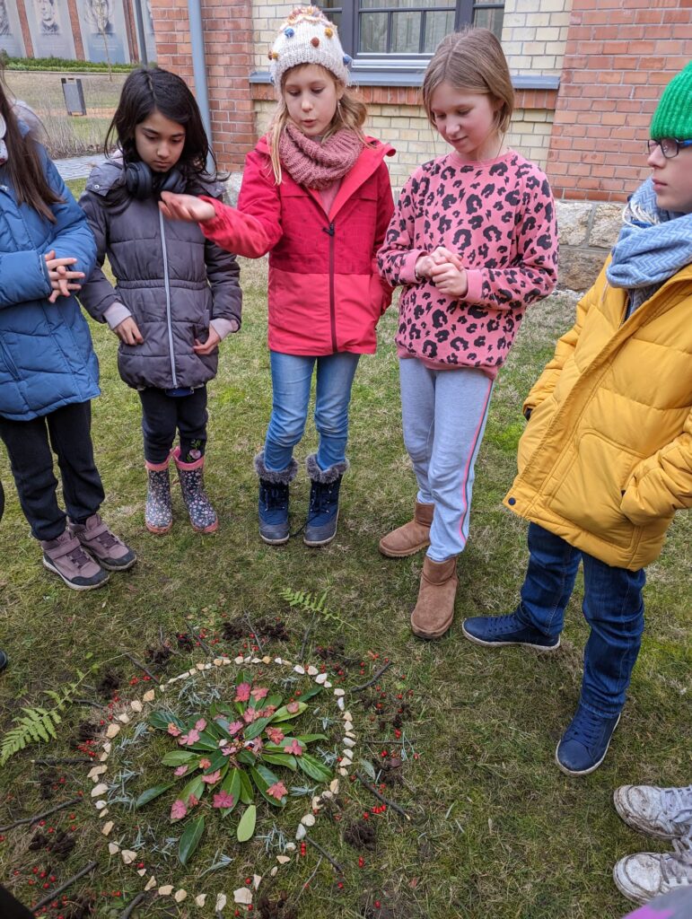 Learners sharing her nature-based mandala with their peers. Photo by Carmelo Zamora, REAL School Budapest